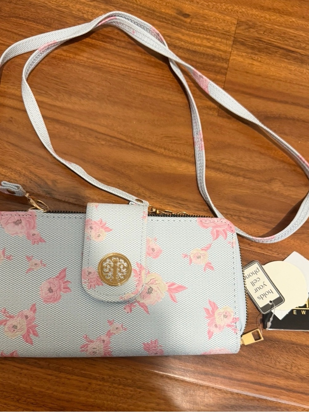 Tasha Light Blue Crossbody Wallet with Pink Floral Accents and Gold Emblem
